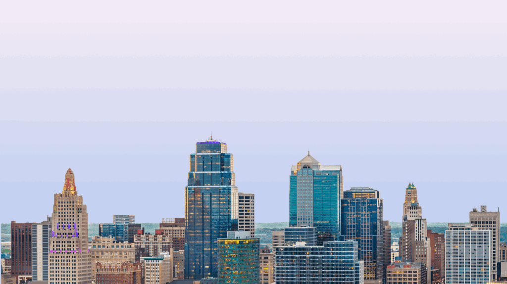 City skyline with modern high-rise buildings under a clear sky.